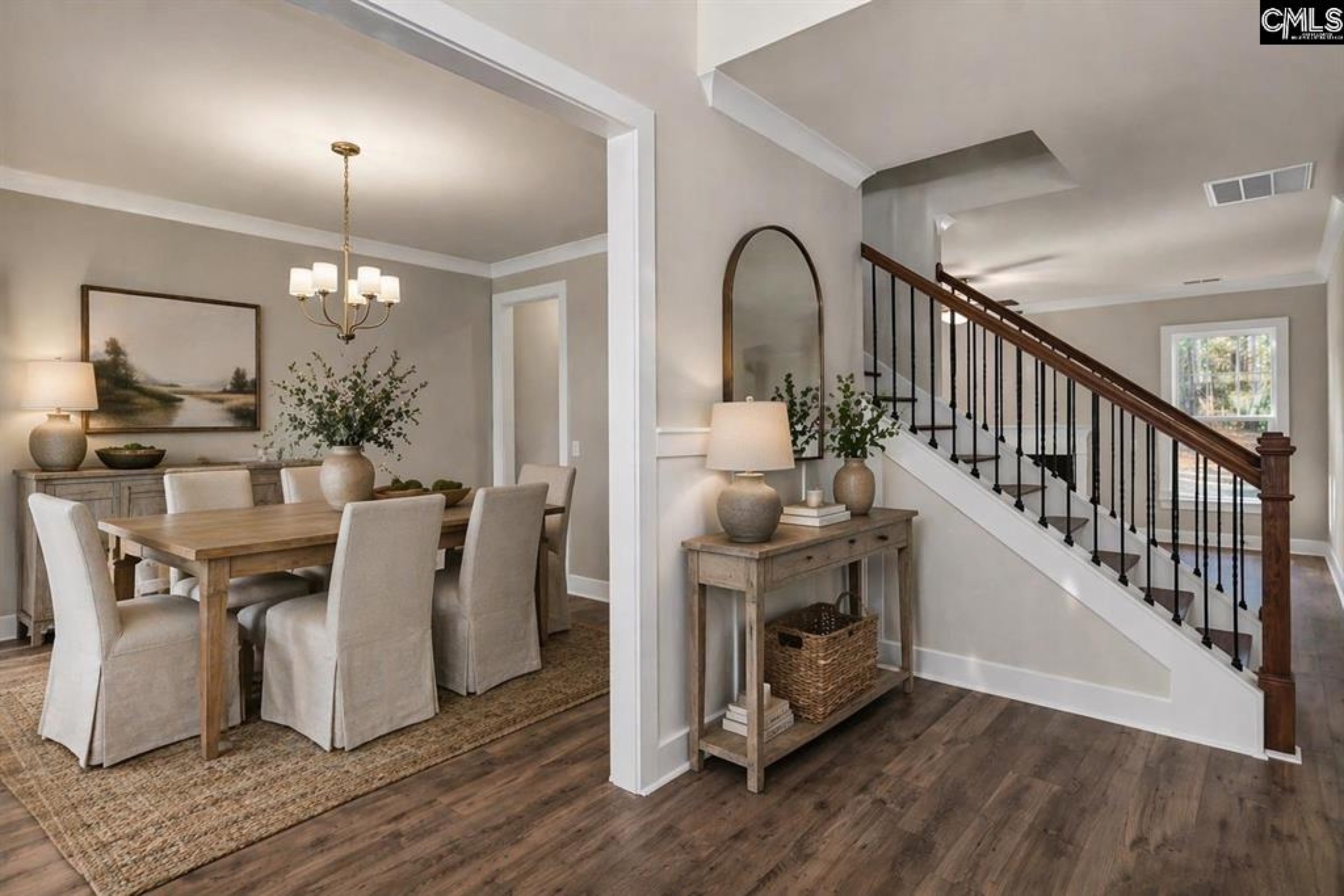 Elegant dining room and staircase entry in a Conquest Homes custom build